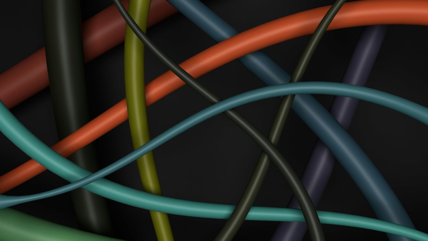 Close up of criss-crossing colour cables.